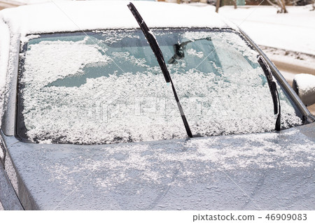 The car is in the cold. The wipers stick out The car is in the cold. The wipers stick out 46909083