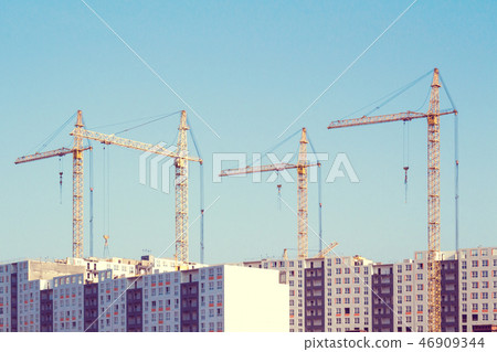 Cranes and building construction. Toned 46909344