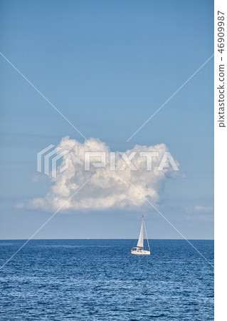 Lonely yacht on the horizon. Lonely yacht on the horizon. 46909987