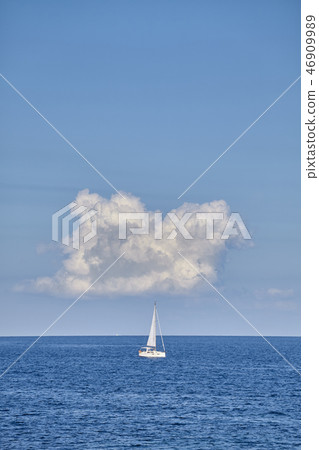 Lonely yacht on the horizon. Lonely yacht on the horizon. 46909989