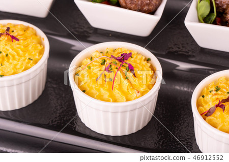 Potatoes puree baked in an oven with green onions Potatoes puree baked in an oven with green onions 46912552