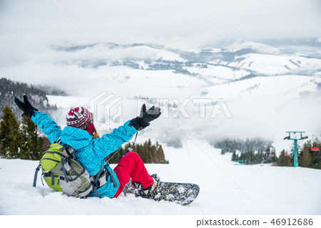 Young woman on the snowboard 46912686
