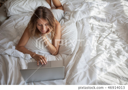 Woman Enjoying Morning And Using Laptop 46914013