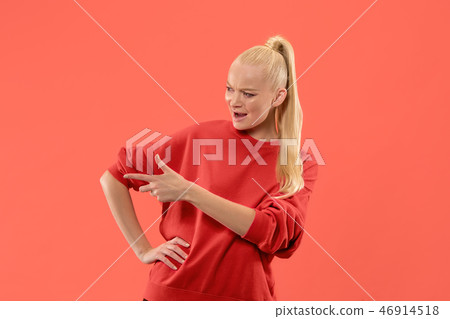 Isolated on coral young casual woman shouting at studio Isolated on coral young casual woman shouting at studio 46914518