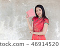 asian woman wearing red traditional dress   46914520
