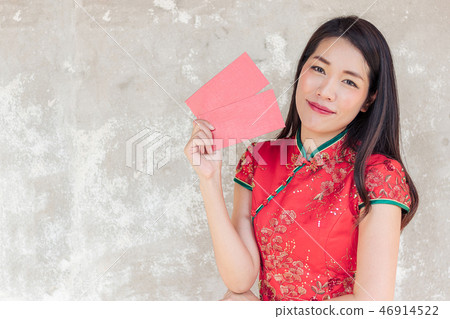 asian woman wearing red traditional dress holding asian woman wearing red traditional dress holding 46914522