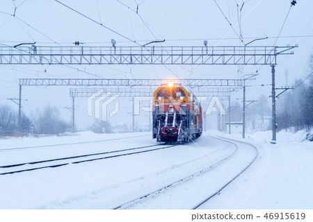 railway snow machine at station during snowfall railway snow machine at station during snowfall 46915619