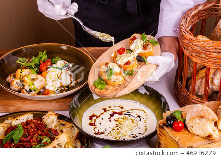 Dried tomatoes with cheese on toasts with greens Dried tomatoes with cheese on toasts with greens 46916279