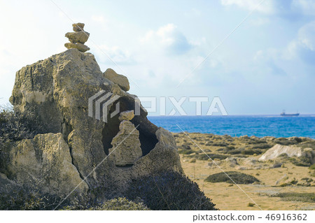 Tower of rocks on beach Tower of rocks on beach 46916362