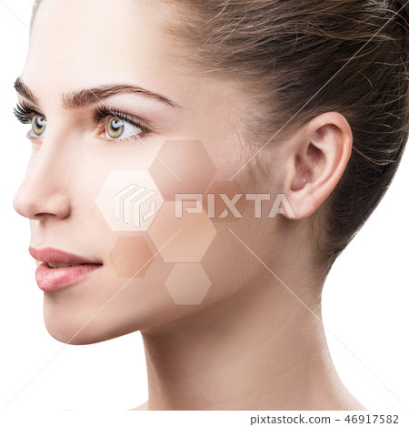 Beautiful female face in honeycombs. Beautiful female face in honeycombs. 46917582