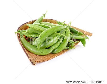 fresh sugar snap pea in bamboo basket on white 46919045