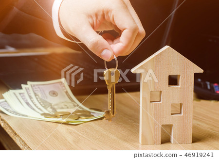 Realtor holds house keys. Real estate agent. Realtor holds house keys. Real estate agent. 46919241
