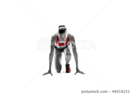 Portrait of young sporty woman at starting block of race isolated over white background Portrait of young sporty woman at starting block of race isolated over white background 46919252