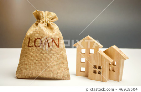 Wooden houses and a bag with the word Loan.  46919504