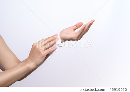 Woman cleaning hand with white soft tissue paper Woman cleaning hand with white soft tissue paper 46919930