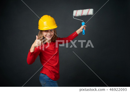 Decoration, renovation and reconstrucion concept. Painting girl Decoration, renovation and reconstrucion concept. Painting girl 46922093