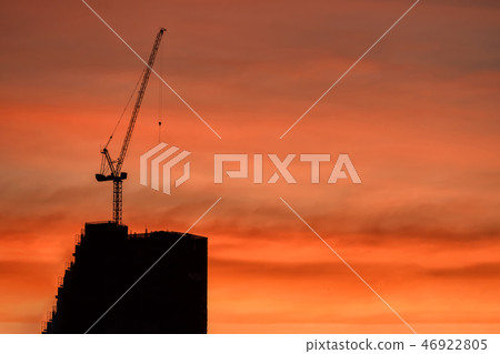 Silhouette crane and building construction at dusk Silhouette crane and building construction at dusk 46922805