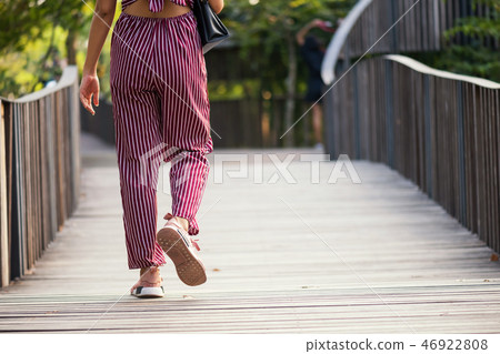 ipster woman walk in park ipster woman walk in park 46922808