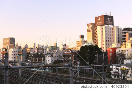 Tokyo cityscape in Japan I look at the hotel area that spreads in front of Kuwaya station in the evening sun Tokyo cityscape in Japan I look at the hotel area that spreads in front of Kuwaya station in the evening sun 46923204