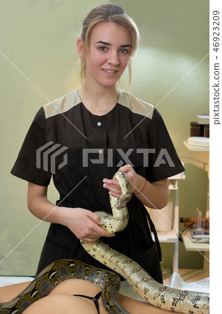 Snake massage treatment of health problems. 46923209