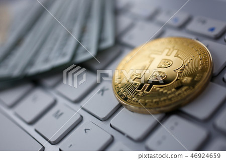 Coin crypto currency bitcoin lies on the keyboard 46924659