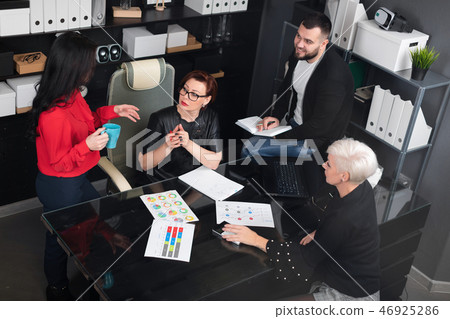 Office workers discuss their project over Cup of tea 46925286