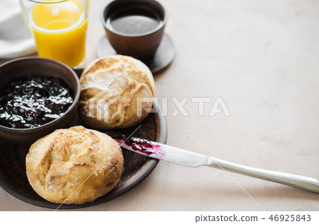 Coffee americano, fresh buns with jam and juice. Coffee americano, fresh buns with jam and juice. 46925843