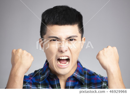 asian man with angry and mad face 46929966