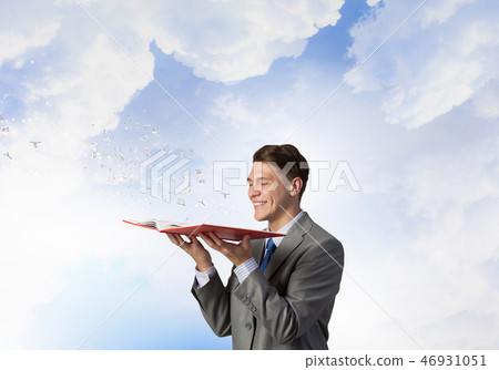 Businessman with opened book 46931051