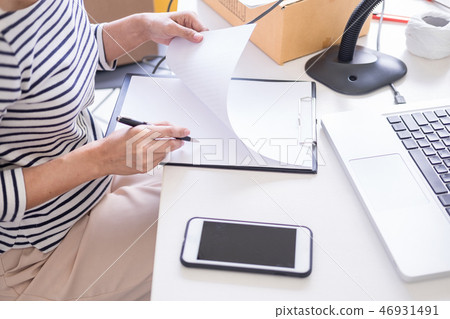 Businessman Shop owner  check Order or list inventory in stock w 46931491