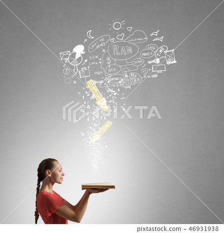Girl holding opened book Girl holding opened book 46931938