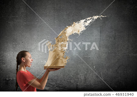 Girl holding opened book Girl holding opened book 46931940