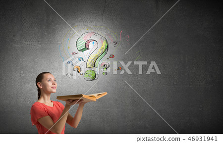 Girl holding opened book Girl holding opened book 46931941