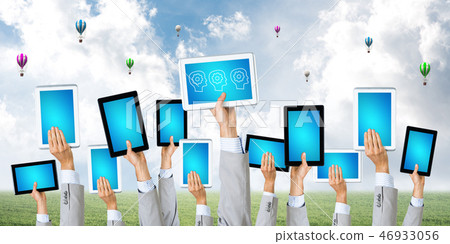 Close of businessman hands in line showing tablet pc with blank blue screen Close of businessman hands in line showing tablet pc with blank blue screen 46933056