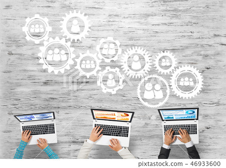 Top view of businesspeople sitting at table and using gadgets 46933600