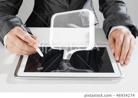 Female hands using graphics tablet and glass icons fly in air. Mixed media Female hands using graphics tablet and glass icons fly in air. Mixed media 46934274