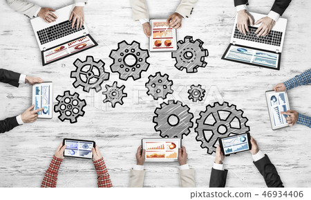 Top view of businesspeople sitting at table and using gadgets 46934406