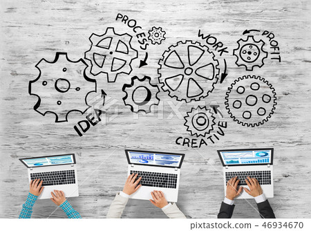 Top view of businesspeople sitting at table and using gadgets 46934670