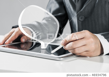 Female hands using graphics tablet and glass icons fly in air. M Female hands using graphics tablet and glass icons fly in air. M 46934796