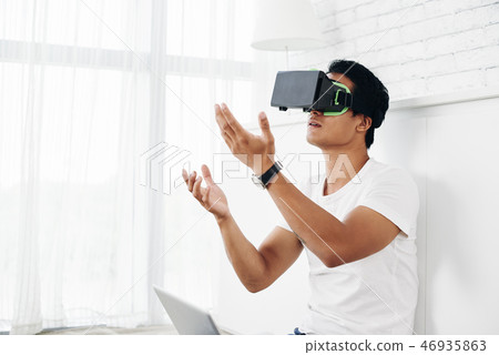 Young man in vr glasses 46935863
