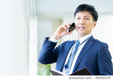 Male employee who calls a young businessman Male employee who calls a young businessman 46936559