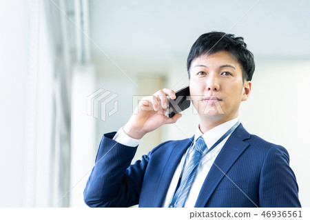 Male employee who calls a young businessman Male employee who calls a young businessman 46936561