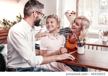 Positive cheerful girl smiling to her father 46938935