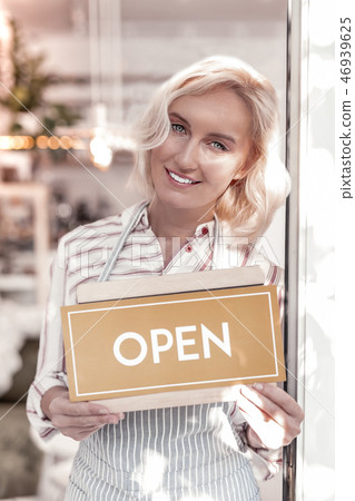 Cheerful nice woman opening her own cafe 46939625