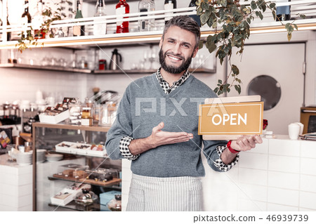 Cheerful nice man showing thumbs up gesture 46939739