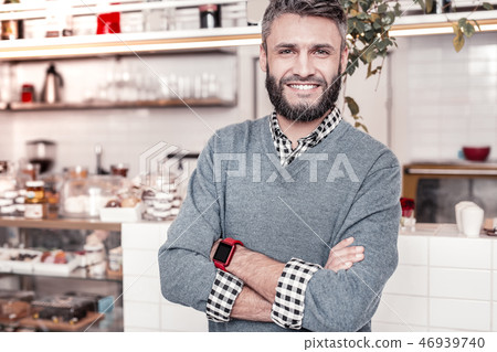 Delighted good looking man pointing at the open door sign 46939740
