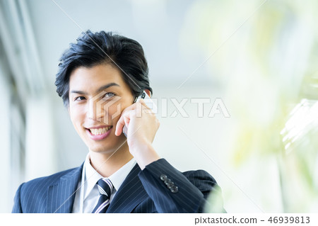 Male employee who calls a young businessman Male employee who calls a young businessman 46939813