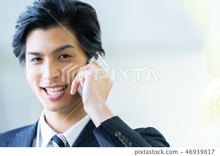 Male employee who calls a young businessman Male employee who calls a young businessman 46939817