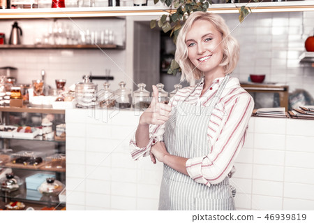 Happy delighted woman showing you OK sign Happy delighted woman showing you OK sign 46939819
