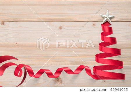 Christmas tree ribbon red bow band isolated wood Christmas tree ribbon red bow band isolated wood 46941025